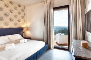 Postel nebo postele na pokoji v ubytování Relais Chiaramonte + 37 fotografií