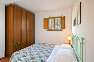 Säng eller sängar i ett rum på Agriturismo Il Sambuco