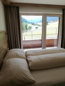 Cama ou camas em um quarto em Alps Tux