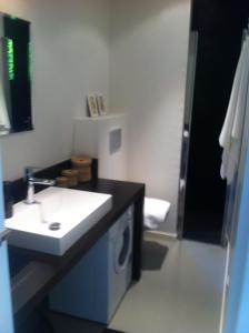 a bathroom with a sink and a mirror at T2 L'Escapade in La Ciotat +9 photos