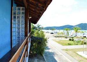 a balcony of a house with a view of the water at Pousada do Imperador in Paraty