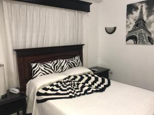 Postel nebo postele na pokoji v ubytování Hotel Rey