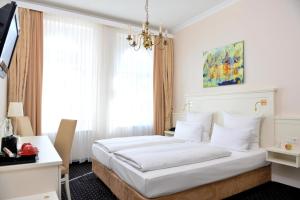 Postel nebo postele na pokoji v ubytování Hotel Fürst Bismarck