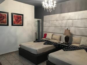 Postel nebo postele na pokoji v ubytování Hotel Rey
