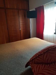 Una cama o camas en una habitación de Club Sol Mar Del Plata