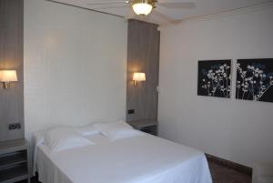 Postel nebo postele na pokoji v ubytování Hotel Grifeu