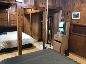 A bed or beds in a room at Mannaya -SEVEN Hotels and Resorts-