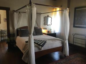 A bed or beds in a room at The Inn At The Convent