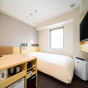 Letto o letti in una camera di Super Hotel Tokyo Shiba