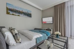 Posteľ alebo postele v izbe v ubytovaní P&O Apartments Służewiec