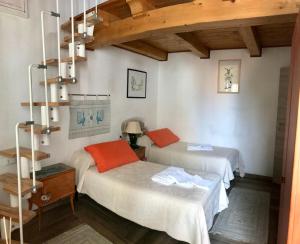 Postel nebo postele na pokoji v ubytování B&B Pascal House Nuoro_IUN E5016