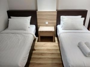 Postel nebo postele na pokoji v ubytování Classy Studio Apartment (KBCP)