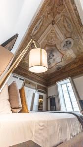A bed or beds in a room at Relais Della Porta