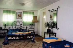 a bedroom with two beds and a mirror at Motel Królowej Jadwigi in Sandomierz