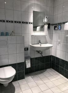 Kylpyhuone majoituspaikassa Hotel Luxer