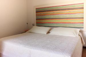 Postel nebo postele na pokoji v ubytování B&B a Ca' Minore Franciacorta