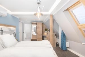 Postel nebo postele na pokoji v ubytování Hotel dasPaul