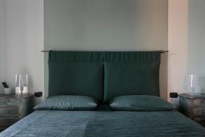 Postel nebo postele na pokoji v ubytování B&B a Ca' Minore Franciacorta