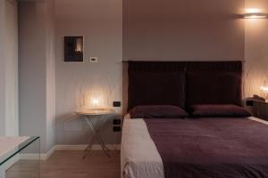 Postel nebo postele na pokoji v ubytování B&B a Ca' Minore Franciacorta