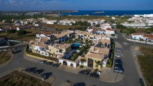 an aerial view of a town with houses and the ocean at Sagres Time Apartamentos in Sagres