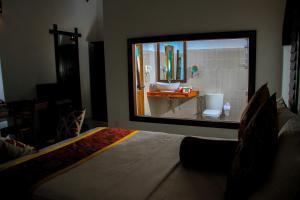 Llit o llits en una habitació de Palmyra Nature Resort Sigiriya