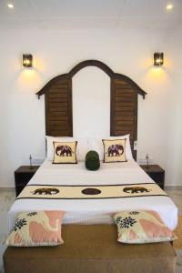 Postel nebo postele na pokoji v ubytování Palmyra Nature Resort Sigiriya