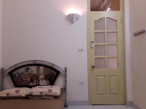 Postel nebo postele na pokoji v ubytování Homestay Nam Dong