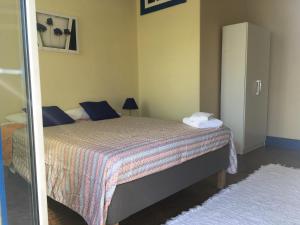 Postel nebo postele na pokoji v ubytování Aveiro Train Guesthouse