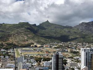 a view of a city with mountains in the background at Sea & City View Luxury Apartment in Port Louis