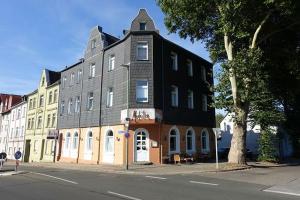 a large building on the corner of a street at Ferienwohnung Branka in Essen