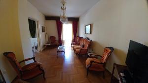 Televízia a/alebo spoločenská miestnosť v ubytovaní Proteus Apartment