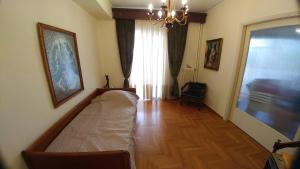 Posteľ alebo postele v izbe v ubytovaní Proteus Apartment