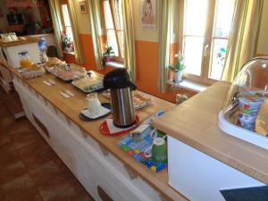 a counter in a kitchen with a coffee maker on it at Pension Himmelreich in Ternitz