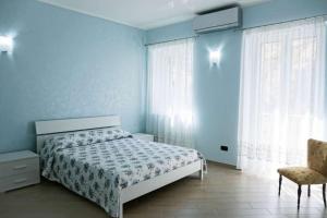 Ein Bett oder Betten in einem Zimmer der Unterkunft Il Terrazzo su Pizzo