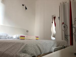 Postel nebo postele na pokoji v ubytování 21House - Appartamento 1