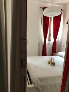 Postel nebo postele na pokoji v ubytování 21House - Appartamento 1