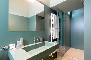 a bathroom with a sink and a mirror at B&Bari, via Cairoli - guesthouse Le Case di Aurelia in Bari