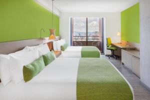 Ένα ή περισσότερα κρεβάτια σε δωμάτιο στο Hotel Bari Bucaramanga
