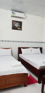 En eller flere senger på et rom på Phu Quoc Beach Guesthouse