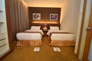 Postel nebo postele na pokoji v ubytování Tenera Hotel
