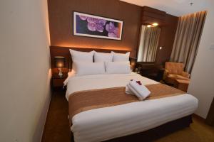 Postel nebo postele na pokoji v ubytování Tenera Hotel