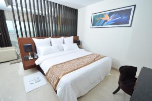 Postel nebo postele na pokoji v ubytování Tenera Hotel