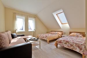 Llit o llits en una habitació de Karklės Villa