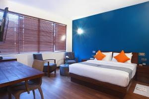 Voodi või voodid majutusasutuse Colombo Court Hotel & Spa toas