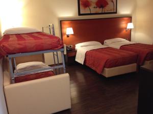 Letto o letti in una camera di Gullo Hotel