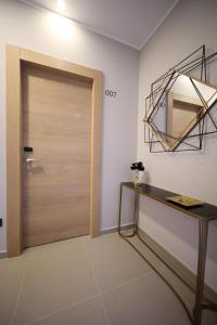 a door leading to a room with a wooden floor at Teatro Verdi Boutique Hotel in Zadar
