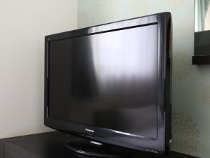 Télévision ou salle de divertissement dans l'établissement Hotel Wing International Himeji