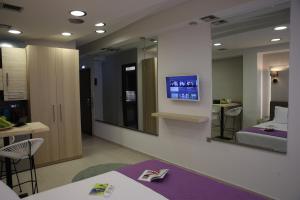 A television and/or entertainment centre at Aiolos Apartments Suites Ermou 64 Monastiraki Plaka 2nd Floor
