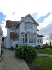 a white house with a large window at The Wansbeck in Oamaru