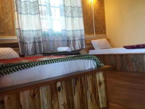 Letto o letti in una camera di Vamoose Soshing Homestay